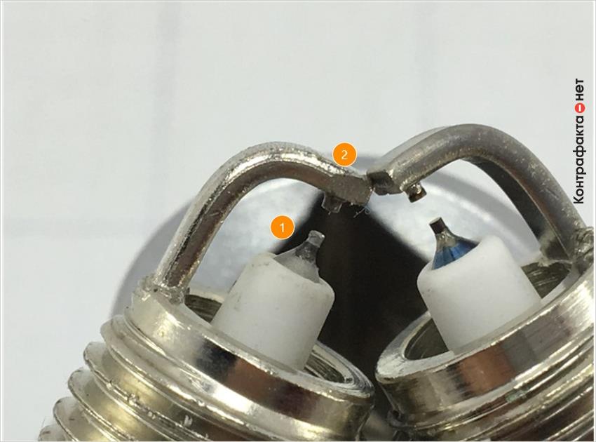 1. Отличается центральный электрод, цветовой оттенок металла сердечника не соответствует оригиналу. | 2. Боковой электрод имеет конструктивное отличие.