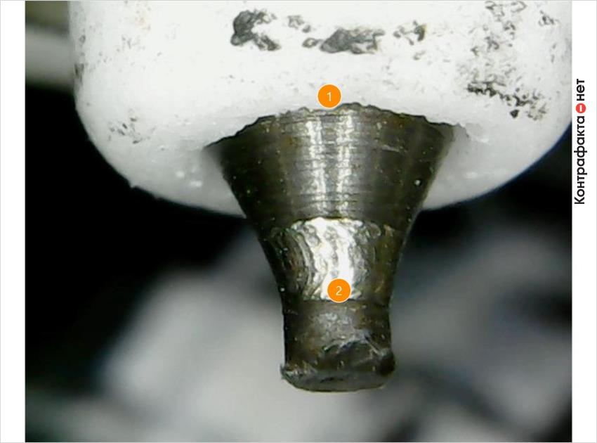 1. Колотые края керамического изолятора. | 2. Центральный электрод заменен железоникелевым.