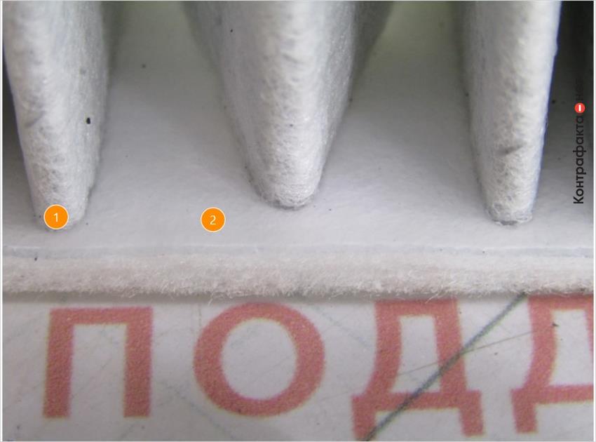 1. Фильтрующие ламели не доходят до кромки корпуса фильтра. | 2. Прозрачный клеящий материал( в оригинале белый).
