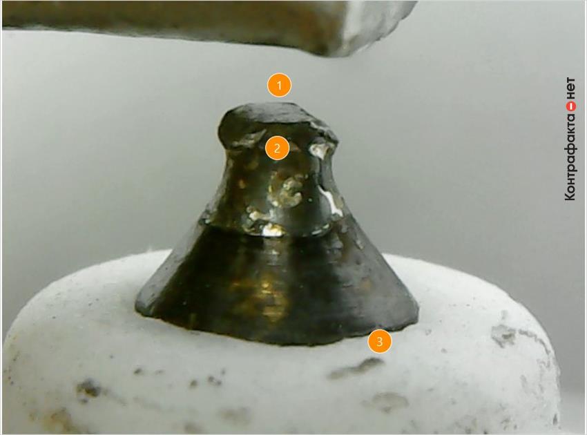 1. Искривленная форма центрального электрода. | 2. Иридиевый наконечник заменен железо-никелевым. | 3. Следы производственного загрязнения.